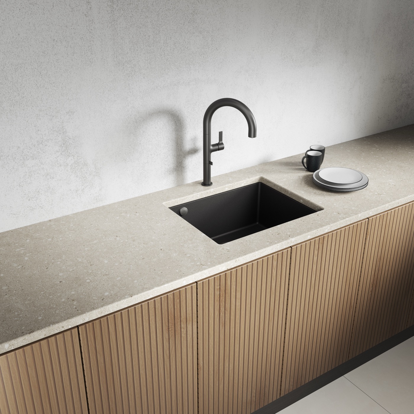 Black Laveo undermount sink in a light stone worktop